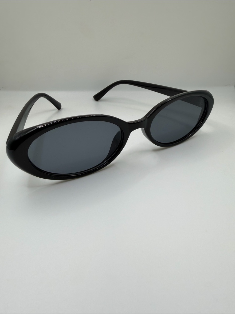 Amazon Black Oval Sunglasses with Dark Lenses